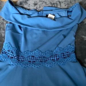 Off the shoulder fit and flare dress with cut out waist. Size 11/12